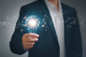 Aufkleber - Hand of businessman holding illuminated light bulb with network connection line, idea, innovation and inspiration concept. concept creativity with bulbs that shine glitter..