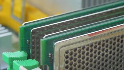 DDR RAM sticks on green electric circuit board PCB background. Double data rate random access memory. Computer memory module with contact pins. Heat spreader