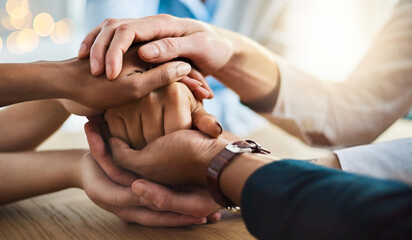 Poster - Trust and support. Cropped shot of a group of unrecognizable businesspeople sitting in the boardroom with their hands in a huddle.