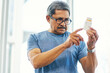 © Tamani Chithambo/peopleimages.com - This looks like itll work. Cropped shot of a handsome senior man reading a bottle of prescription medication.