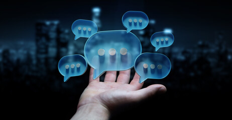 Wall Mural - Businessman in dark using digital speech bubbles talk icons. Minimal conversation or social media messages floating over user hand. 3D rendering