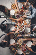 © New Africa - Group of people having brunch together at table indoors, top view