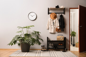 Wall Mural - Hallway interior with stylish furniture, clothes and accessories