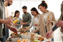 Group Of People Enjoying Brunch Buffet Together Indoors