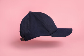Wall Mural - Baseball cap on pink background. Mock up for design
