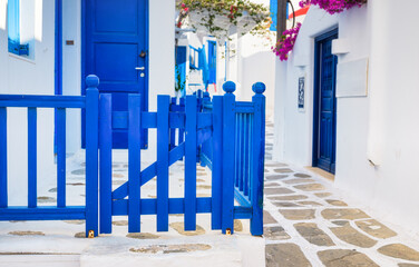 Wall Mural - The island of Mykonos, Greece. Streets and traditional architecture. Entrance to a private home. Travel photography.