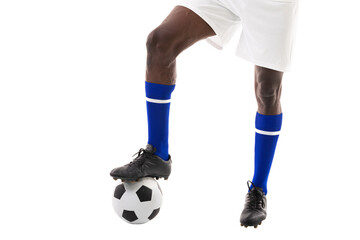 Low section of african american male player stepping on soccer ball over white background