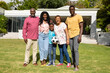 Portrait of happy african american multi-generational family standing in front yard