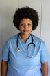 © WavebreakMediaMicro - Portrait of confident african american mid adult female nurse with stethoscope standing in hospital