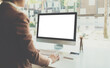 © PaeGAG - Young woman work on laptop with blank display screen with mockup copy space. Modern home living room interior design. Work at office concept.