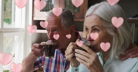 Wall Mural - Animation of heart icons over senior couple drinking coffee