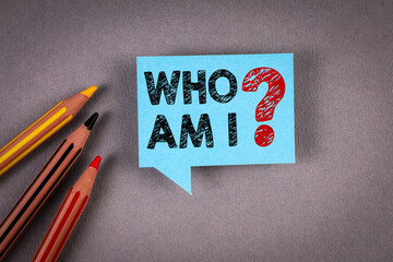 Who Am I. Blue speech bubble on a gray background