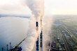 © volody10 - Aerial view of coal power plant high pipes with black smoke moving up polluting atmosphere at sunset.