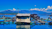 Fishing Floating Village. Vietnamese Fishermen Catch And Grow Fish.