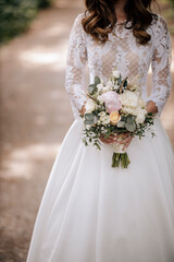 Wall Mural - Bride with flowers in hands