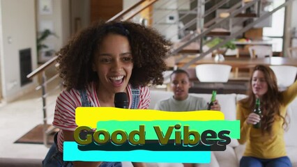 Poster - Animation of good vibes text over smiling diverse friends singing and drinking beer