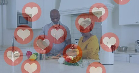 Wall Mural - Animation of heart icons over senior african american couple in kitchen