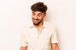 © Asier - Young hispanic man isolated on white background laughs and closes eyes, feels relaxed and happy.