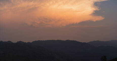 Canvas Print - silhouette and panorama layer of mountain with sunset background