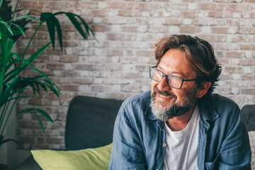 cheerful mature man in living room