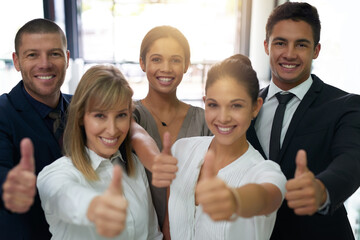 Aufkleber - We believe in your ability to reach the top. Portrait of a group of businesspeople showing thumbs up in an office.