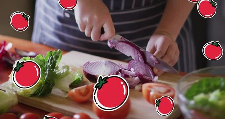 Poster - Animation of red tomato icons over caucasian woman cutting vegetables