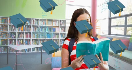 Canvas Print - Animation of graduation hats falling over caucasian female student with book