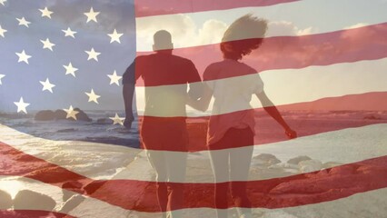 Wall Mural - Animation of flag of usa over african american couple at beach