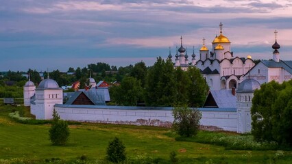 Sticker - Suzdal, Russia. Panoramic view of Intercession (Pokrovsky) Monastery in Suzdal, Russia during a cloudy evening. Golden tour trip in Russia. Time-lapse with fast moving clouds, panning video