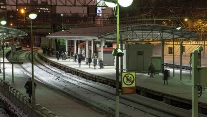 Wall Mural - Arrival and departure of suburban trains to the station platform, time lapse