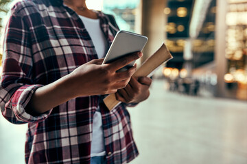 Poster - I have my timesheet on my cellphone. Cropped shot of an unrecognizable female student using a cellphone outside on campus.