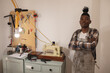 © Wavebreak Media - Portrait of african american young craftsperman with arms crossed by sewing machine in workshop
