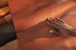 © Wavebreak Media - Cropped hand of african american young craftsman touching brown leather