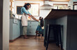 © Chanelle M/peopleimages.com - I sustain myself with the love of family. Shot of a young woman dancing with her daughter in the kitchen at home.