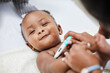 © Siphosethu Fanti/peopleimages.com - Youre such a beautiful baby. Shot of a little baby having her temperature taken by a doctor with a thermometer.