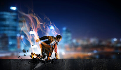 Determined businessman leaving fire trails on asphalt . Mixed media