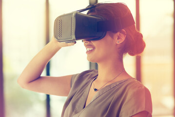 Aufkleber - Taking a trip through cyberspace. Shot of a young businesswoman wearing a VR headset in an office.