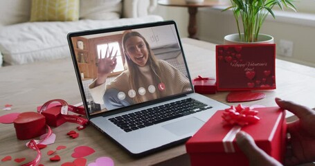 Poster - Happy caucasian woman waving and making valentine's day video call on laptop