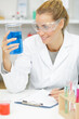 © auremar - female scientist with laboratory glass