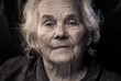 © Victoria Moloman - Portrait of beautiful elderly old woman in colorful bright lights blue and yellow, , 70s, grandmother,  on black background., positive, smiling at camera, happy, studio, Close up, gray hair, caucasian
