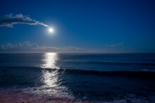 Moonlight Path On Water Of Atlantic Ocean At Night On Tenerife And Dark Blue Sky With Full Moon And Stars