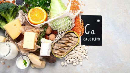 Wall Mural - Healthy food high in calcium on light background.