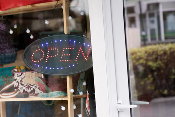 Wall Mural - open boutique text sign board light neon on windows shop restaurant cafe store signboard