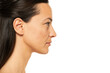 Profile, side view portrait of a beautiful serious woman without makeup on a white background