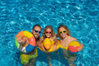 © Sunny studio - Happy family in outdoor pool