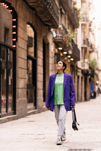Positive Woman In Coat On Street