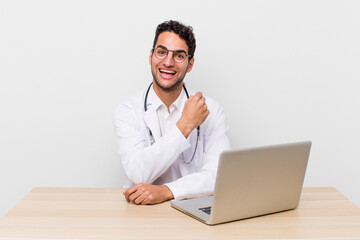 Wall Mural - hispanic handsome man feeling happy and facing a challenge or celebrating. physician concept