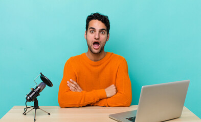 Wall Mural - hispanic handsome man looking very shocked or surprised. influencer concept