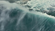 Aerial Top Down View Of Huge Storm Wave Crashing On The Atlantic Coast. Flying On Big Wave Surf In Stormy Weather With Strong Wind. Slow Motion, 4K