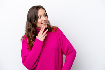 Canvas Print - Young caucasian woman isolated on white background looking up while smiling